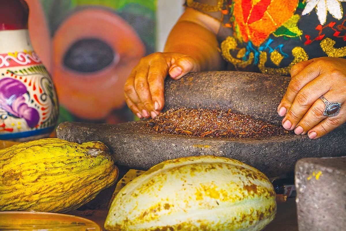 Cacao being ground by hand on a stone